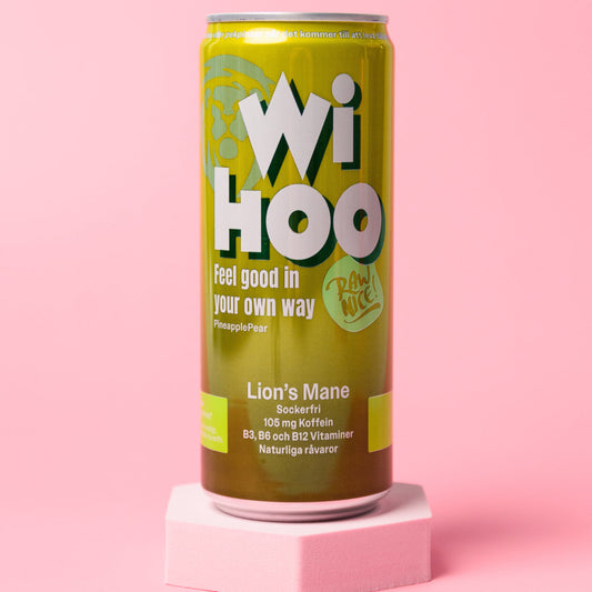 A can of WIHOO Energy Drink with Pineapple & Pear flavor, displayed against a pink background. The can is green with white and yellow text, and an illustration of a mushroom called Lion's Mane.